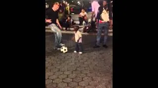 A very short clip toddler plays soccer