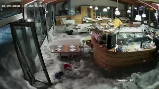 Wave Crashes Through Windows of Italian Restaurant