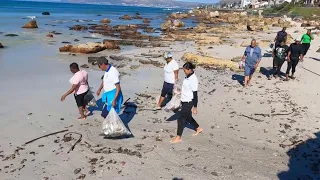 Environmental activists clean up at Cape Town beach to mark Earth Day