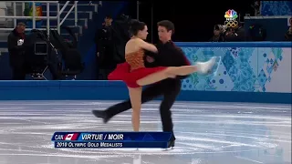 Tessa Virtue and Scott Moir kiss during Sochi 2014 FD warmup