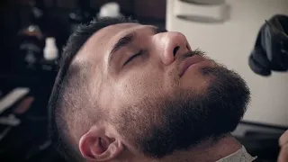 Man receiving a beard trim