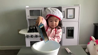 Adorable 2 Year Old Zoey making and eating Funfetti Cupcakes!