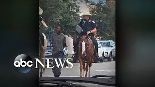 Photo of mounted officers leading black man by rope sparks outrage
