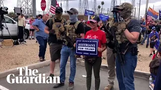 Armed Trump supporters gather outside vote count centre in Arizona