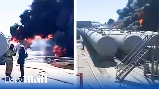 Oil tanks burn in Russia after suspected strike by Ukrainian drones