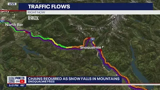 Traffic snarled on Snoqualmie Pass as snow falls | FOX 13 Seattle