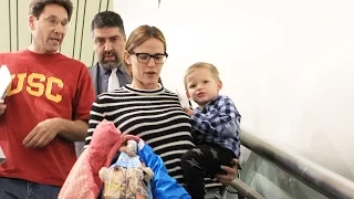 Jennifer Garner Has Her Hands Full Arriving At LAX With The Kids