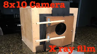 8x10 large format camera, magnifying glass lens, x-ray film and caffenol developer.