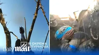 Ukrainian troops hide in trench shooting enemy FPV drones during Russian artillery barrage