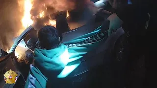 Body cam video shows close call rescue of driver trapped in burning car