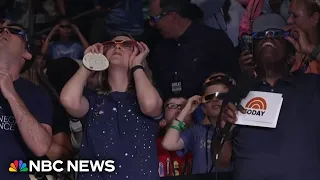 'Just amazing!': Solar eclipse watchers go wild as the moment of totality passes over Dallas
