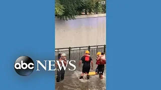 Children rescued from submerged vehicle amid Denver flooding