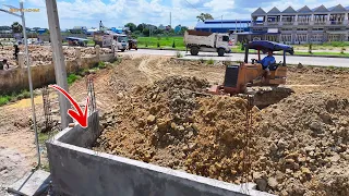 The Update project operator KOMATS'U D31P Dozer Pushing Stone With Soil with Dump Trucks Nissan 5ton