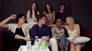 Cole sprouse and Lili reinhart cutely touching hands in an interview