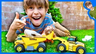 Toy Dump Trucks and Loaders Collect Christmas Rocks!