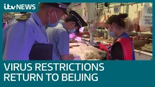 Coronavirus and its restrictions return to Beijing after Covid-19 outbreak at market | ITV News