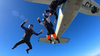 4 people jump out of an airplane.  Trying a 4-way TR jump but we didn't reach each other.