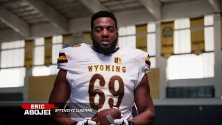 The University of Wyoming football team helps AARP Wyoming promote the FraudWatch Network.