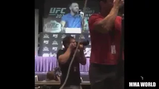 Conor Mcgregor and Nate Diaz throw water bottles at eachother at UFC 202 Press conference