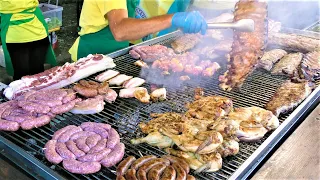 Italy Street Food Festival. Huge Grill, Roasted Piglet, Pork and Lamb Skewers, PitaGyros, Sweets