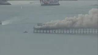 Fire crews contain spread of massive fire that erupted on historic Oceanside Pier