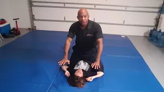 Women's Self-Defense: On your back (Mounted) with wrists pinned to the ground