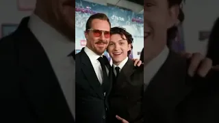 Tom Holland and Benedict Cumberbatch kissing each other