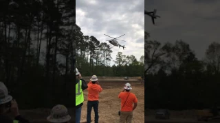 Bell 407 landing behind the Rig