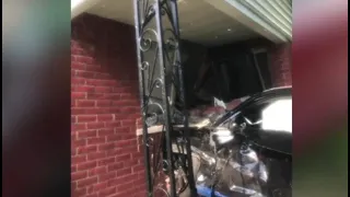 Car crashes into woman's home