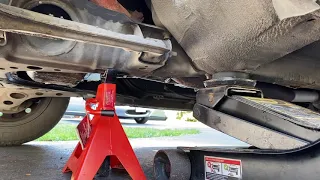 How to jack up a Mazda MX-5 Miata using a hydraulic floor jack.