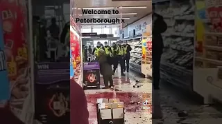 Crazy women smashing bottles in sainsburys