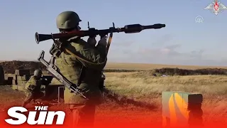 Russian conscripts fire rockets and rifles during military training in Rostov