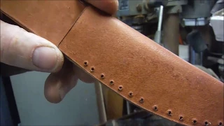 A simple knife sheath with no leather working tools.