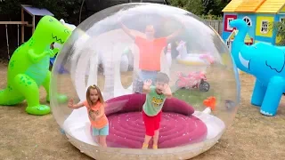 Katy and Max playing in a new kids playhouse