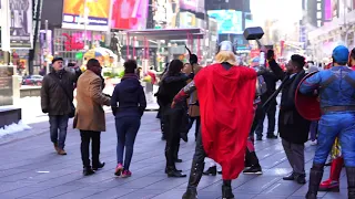 Hailee Steinfeld, Jeremy Renner walk past Times Square comic book characters for 'Hawkeye' in NYC