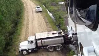 Helicopter landing on Truck in the woods