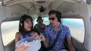 Guy flying scares girl by creating zero gravity.