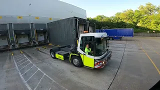 POV truck driving reversing a trailer into a bay inside tesco C+E