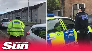 Woman seen ‘covered in blood’ outside Glasgow flat where man found dead