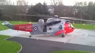 Royal Navy sea king helicopter **CLOSE UP** takeoff from hospital helipad