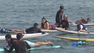 Surfing for a good cause: Children with autism ride the waves