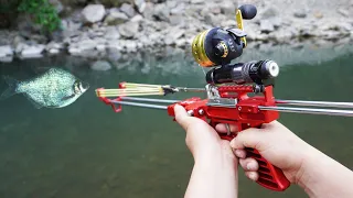 Fishing with mechanical slingshot rifle and darts.