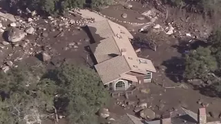 California mudslides' death toll rises as searches continue