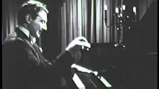 Liberace performing Strauss