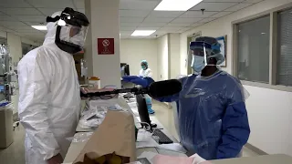 Reporter Gives Desperate Nurse His Protective Mask