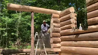 Log Cabin Build PART 16, 35 foot logs over the porch, campfire pizza in the dutch oven