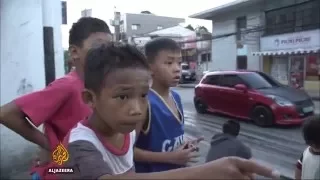 Children in Philippines forced to beg to survive