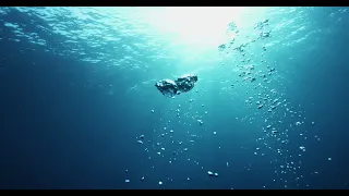 Bubbles rising from beneath ocean surface | Free Stock Video Footage [ NO COPYRIGHT ]