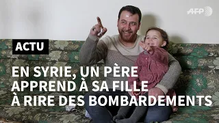 Dans la Syrie en guerre, un père apprend à sa fille à rire des bombardements | AFP News