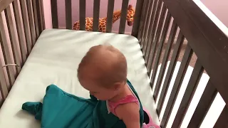 Adorable baby mimics mom